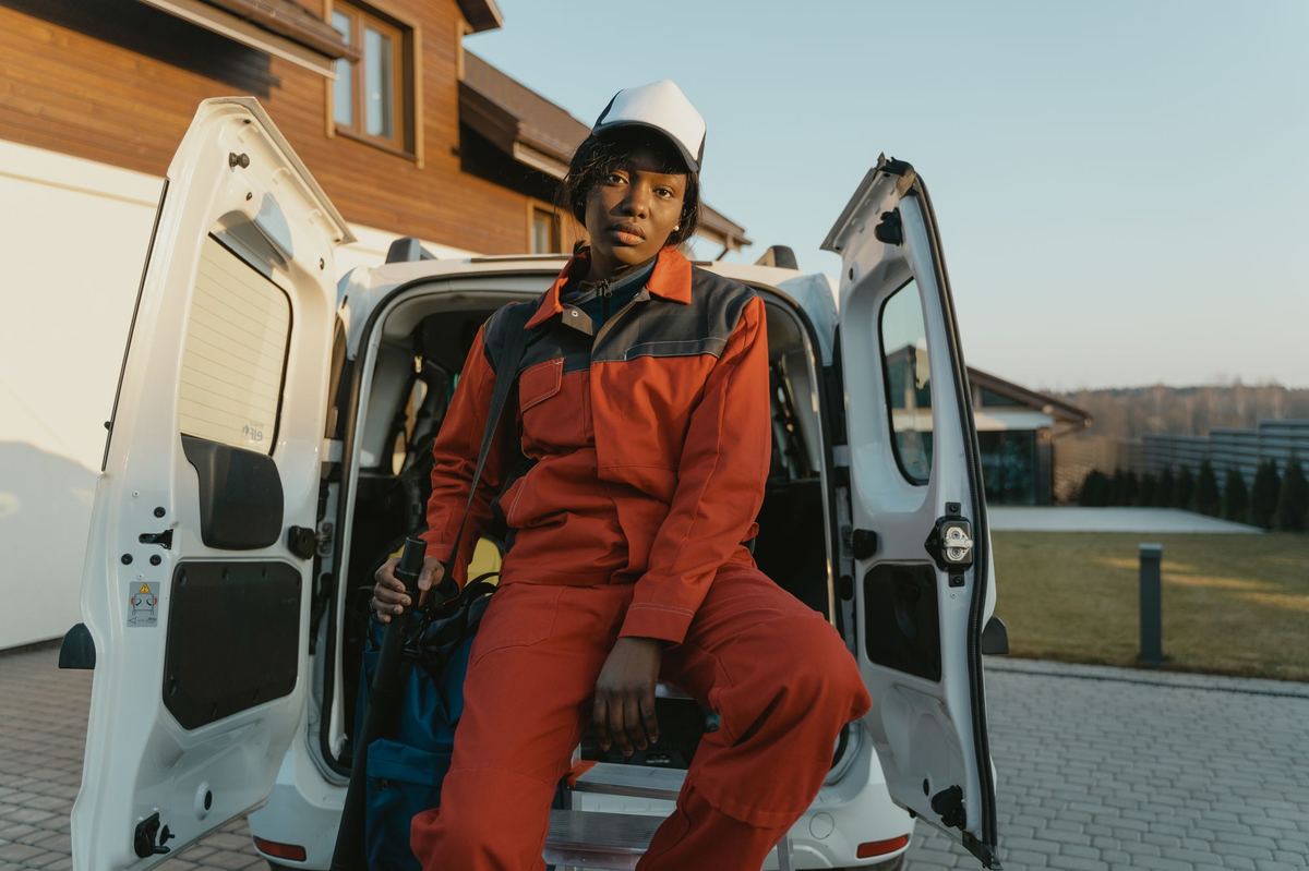 Dana Whitfield sitting in the back of the shop van